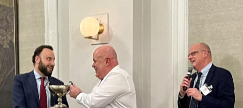 President Fred Gardner accepted it on his behalf from the previous years winner Dr. Francesco Coletti